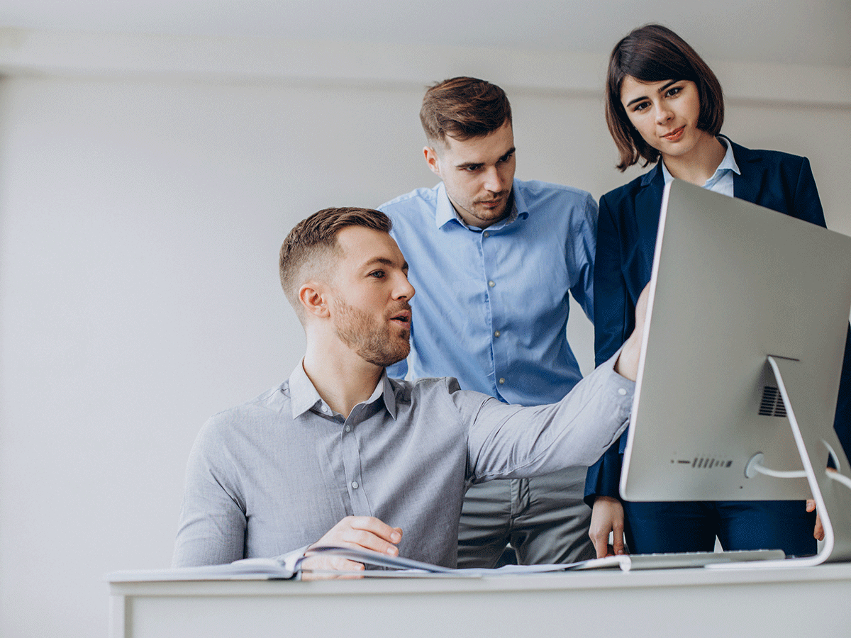 showing-team-work-on-monitor showing-team-work-on-monitor
